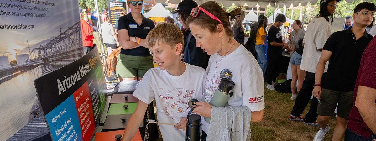 Two people at an arizona water innovation and impact event